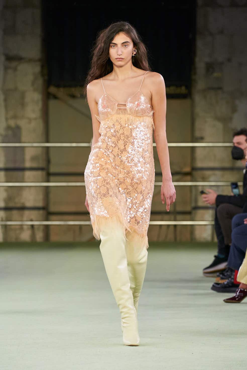 A catwalk at Milan Fashion Week has featured models with three breasts.