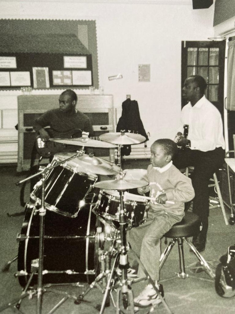 Morgan with his godfather on bass (left) and his dad playing guitar (right)