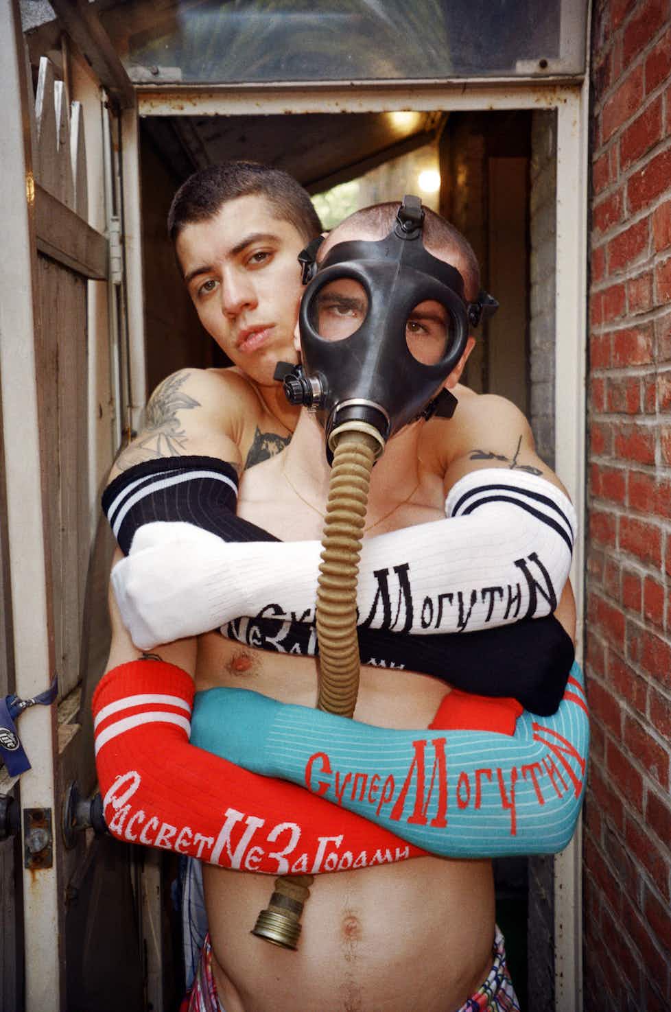 Photograph Erotic style with Nude muscular man wearing a gasmask